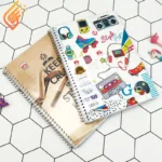 دفتر زبان 2 خط سیمی 100 برگ طرح دار نهال آلما کد 7132